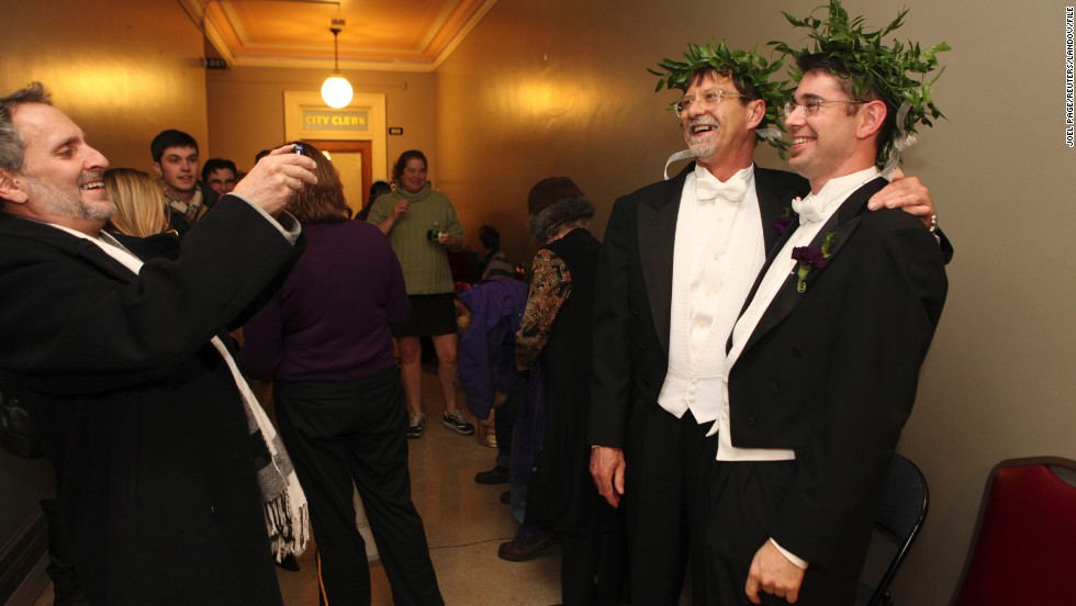 Jamous Lizotte, right, and Steven Jones pose for photos while waiting for a marriage license in Portland, Maine, on December 29, 2012.