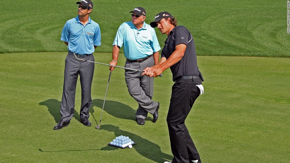 Harmon and his son Claude III working with Adam Scott in 2009. Four years later the Australian won his first major title at the Masters. The Harmons have also helped President Obama refine his swing.