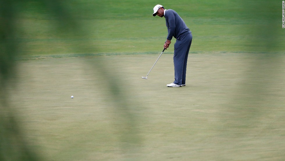 Tiger Woods of the United States putts on the 14th hole on June 14.
