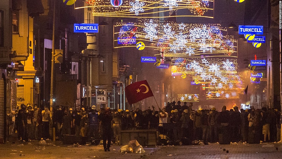 Protesters gather in the main shopping street near Taksim Square in the early morning hours of June 16 as riot police clear Gezi Park in Istanbul. 
