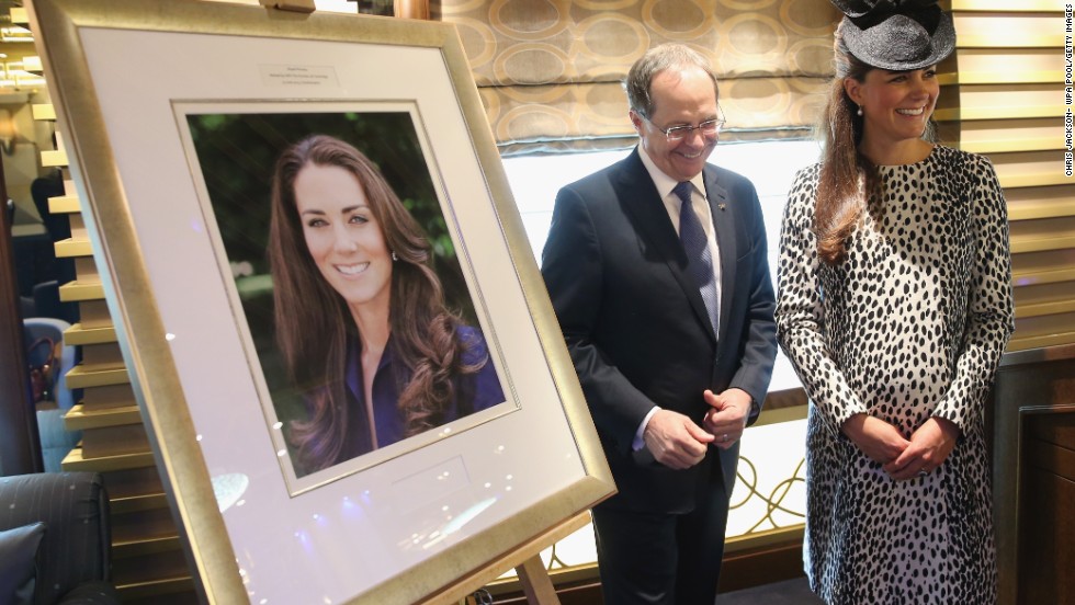 President and CEO of Princess Cruises Alan Buckelew escorts Catherine stands next to an image taken of herself by Getty photographer Chris Jackson after a ship&#39;s naming ceremony at Ocean Terminal on June 13, 2013 in Southampton. This was Catherine&#39;s final public appearance before she gives birth.
