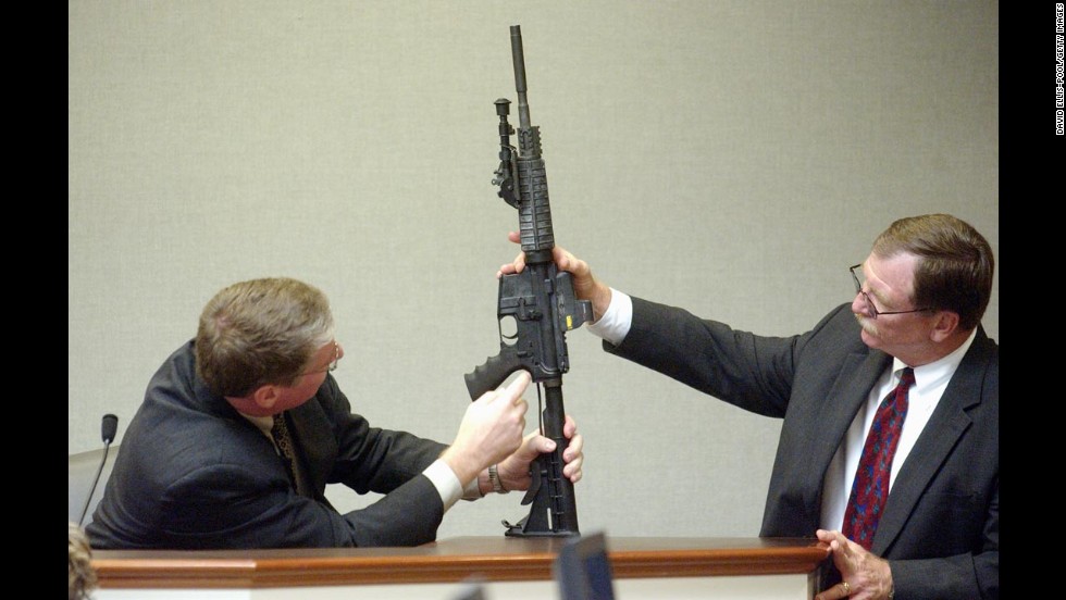 During court proceedings in November 2003, Timothy Curtis points out features on a Bushmaster rifle said to have been used by Muhammad.