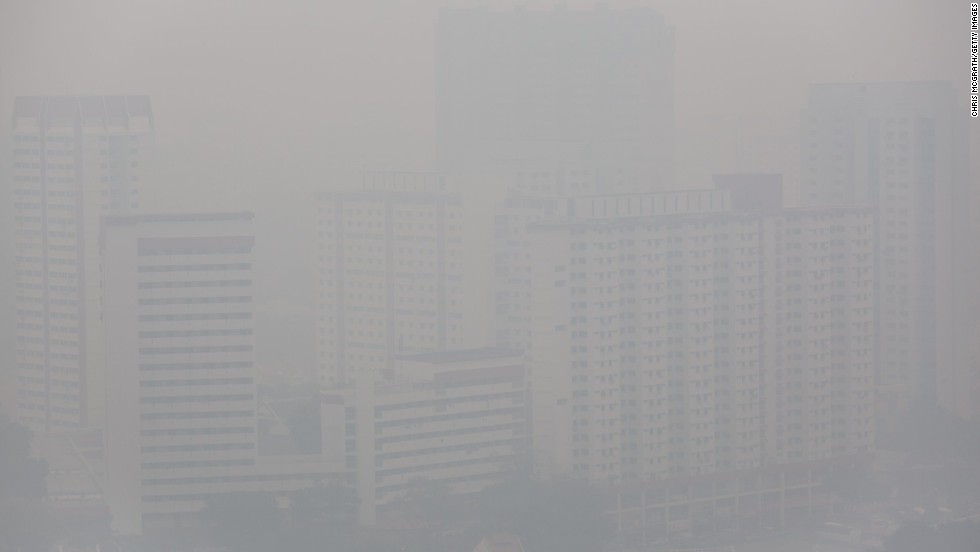 Apartment buildings were shrouded in a haze of smoke on Wednesday, June 19, in Singapore.  The city-state&#39;s worst pollution crisis in more than a decade, the haze stems from illegal slash-and-burn forest fires in neighbouring Sumatra, Indonesia.