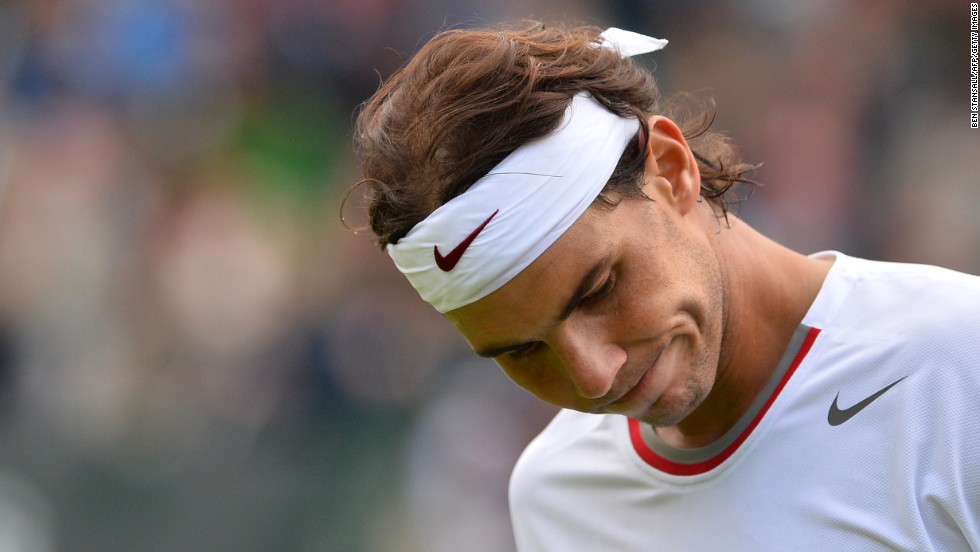 Nadal has also suffered hard times at Wimbledon. Here he reacts after a point in a defeat against Belgium&#39;s Steve Darcis in the first round of Wimbledon 2013. It was his earliest grand slam exit to date. 