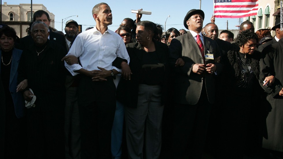 President Barack Obama marches with civil right veterans during a commemoration march in 2007.