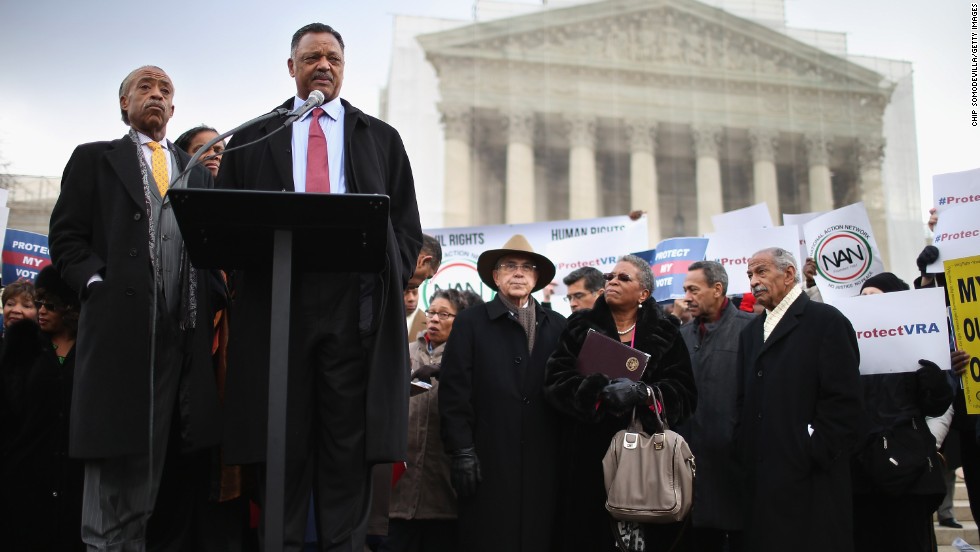 The Rev. Jesse Jackson, at the microphone, and the Rev. Al Sharpton, left, deliver remarks during a rally outside the U.S. Supreme Court on February 27, 2013, as the court prepared to hear oral arguments in Shelby County v. Holder, the legal challenge to Section 5 of the Voting Rights Act. 