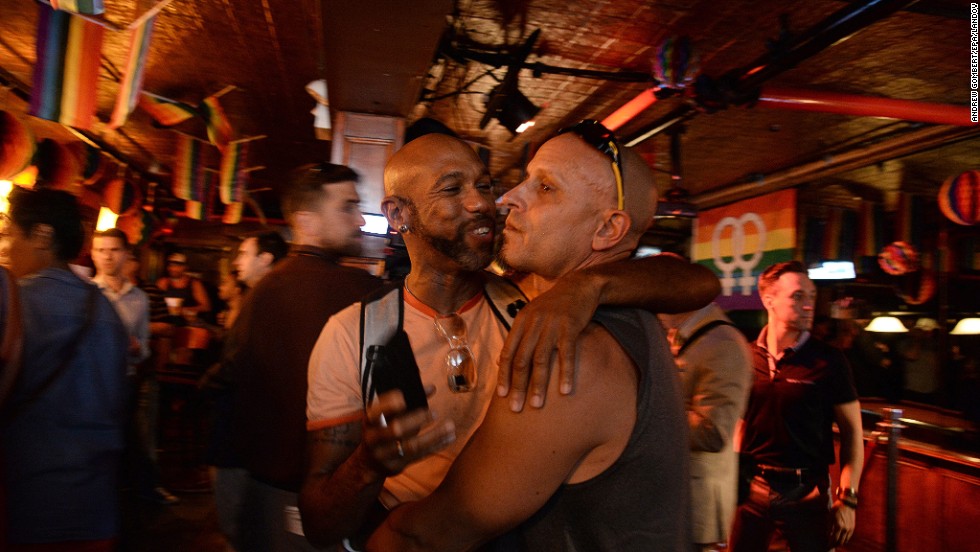 Patrons of the Stonewall Inn in New York gather to hear the Supreme Court rulings.