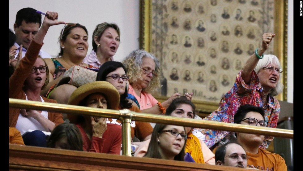 Members of the gallery react as Davis is called for her third and final violation, ending the filibuster. The reaction in the gallery grew so intense that it drowned out the proceedings, preventing lawmakers from completing their vote by the official end of the session -- killing the bill.
