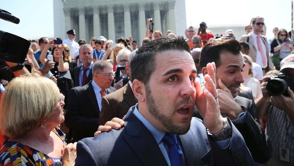 Jeff Zarrillo, center, and Paul Katami, right, plaintiffs in the California case against Proposition 8, wipe away tears after departing the Supreme Court in Washington. &lt;a href=&quot;http://www.cnn.com/video/?/video/politics/2013/06/26/sot-dc-scotus-prop-8-proposal-katami-zarrillo.cnn&quot;&gt;Katami proposed to Zarrillo&lt;/a&gt; on national news after the ruling.