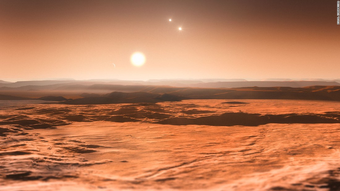 Scientists announced in June 2013 that three planets orbiting star Gliese 667C could be habitable. This is an artist&#39;s impression of the view from one of those planets, looking toward the parent star in the center. The other two stars in the system are visible to the right.