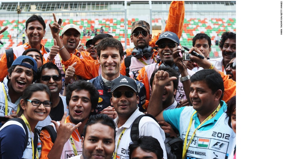 F1&#39;s global marshals are as integral to the sport as the drivers. Here some of the Indian Grand Prix marshals meet Red Bull racer Mark Webber in 2012.