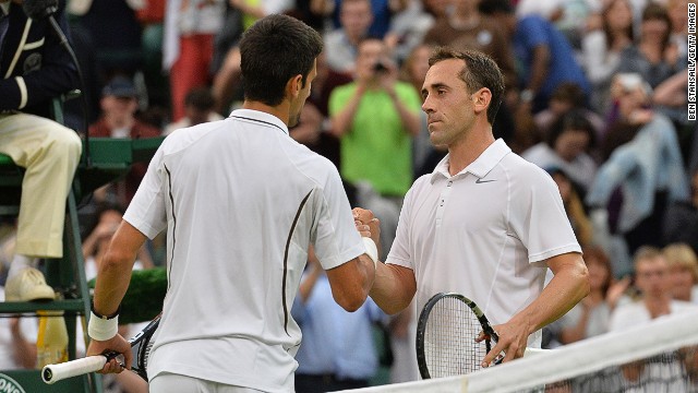 Novak Djokovic shakes hands with Bobby Reynolds, the 11th and last American to exit the men&#39;s singles. 