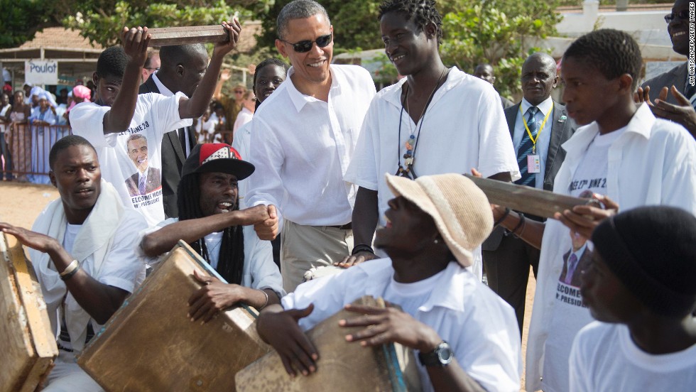 Obama speaks with locals as he tours Goree Island off the coast of Dakar on June 27.