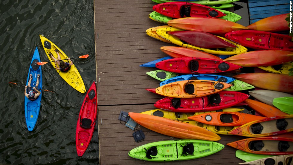 Kayakers cast off from a boathouse on the Potomac River in Washington on June 25.
