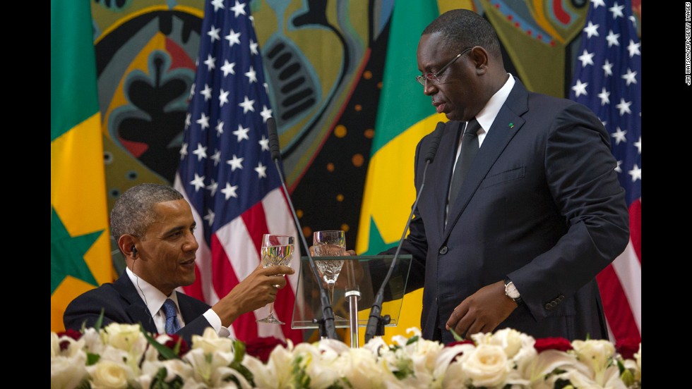 Obama toasts with Senegalese President Macky Sall during an official dinner at the Presidential Palace in Dakar on Thursday, June 27.