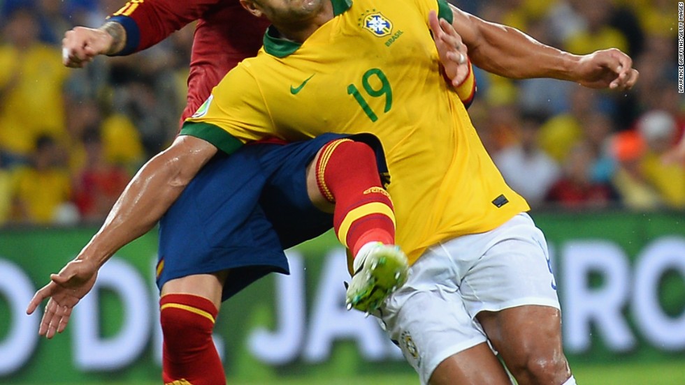 Hulk of Brazil and Sergio Ramos of Spain compete for the ball in a match the hosts dominated.