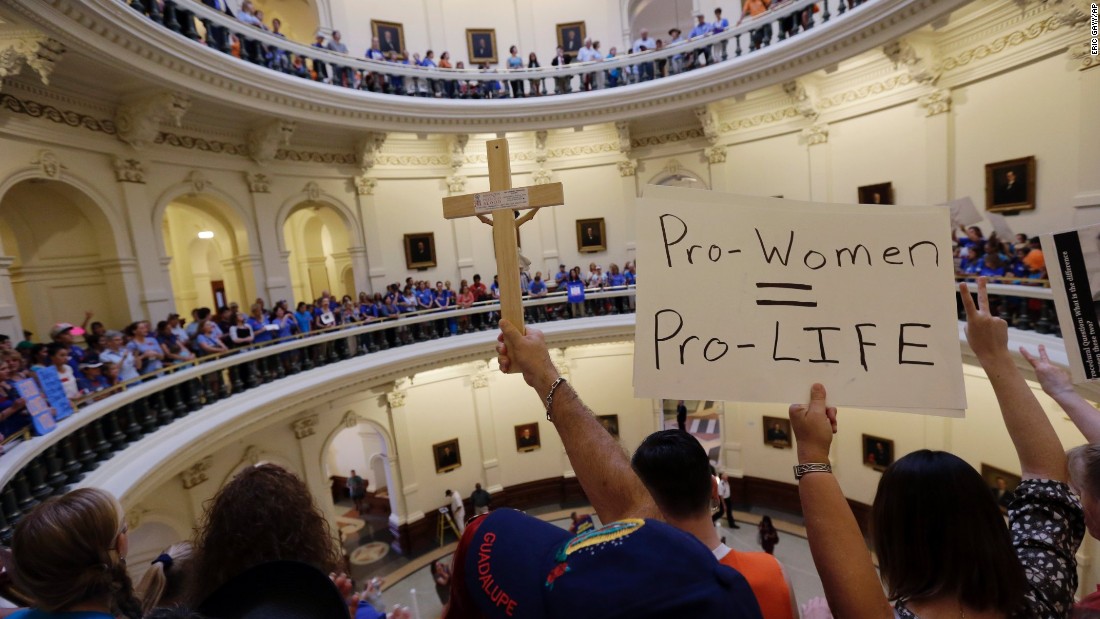 Supporters on both sides of the issue crowd into the rotunda of the state Capitol on July 1, 2013.