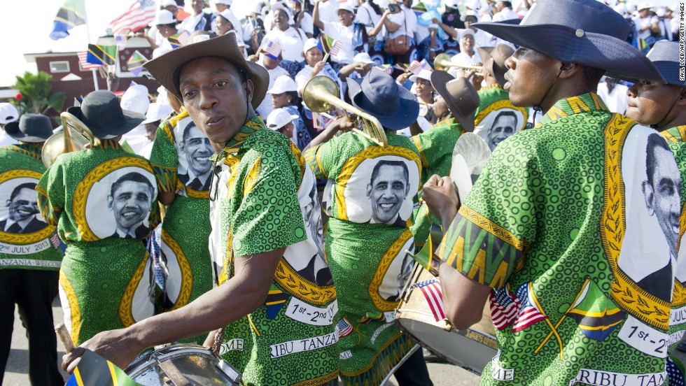 A Tanzanian band plays as the U.S. president and first lady Michelle Obama arrive in Dar es Salaam on Monday, July 1.
