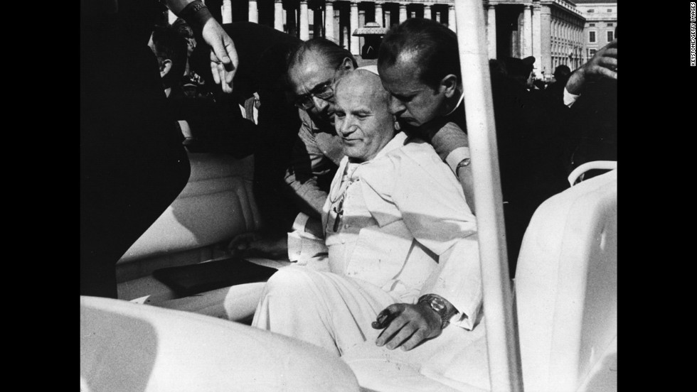 Aides help Pope John Paul II moments after a May 13, 1981, assassination attempt by Turkish gunman Mehmet Ali Agca  in St Peter&#39;s Square.