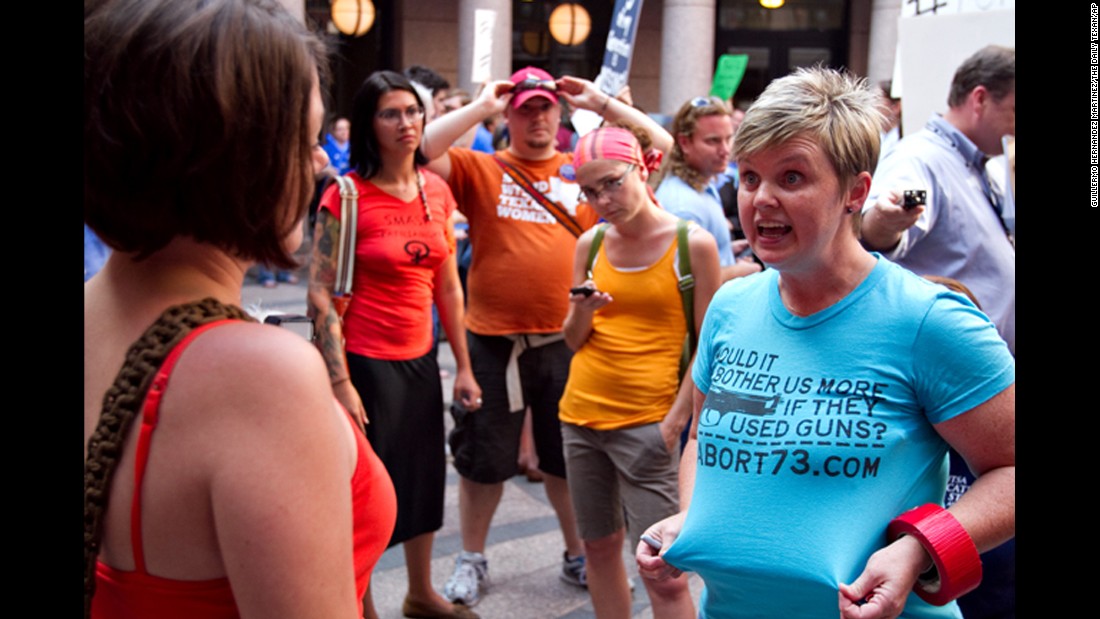 Anti-abortion activist Pamela Whitehead, right, argues with an abortion-rights activist in July 2013.