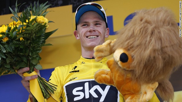 Chris Froome celebrates on the podium after the 195 km eighth stage of the 100th edition of the Tour de France.