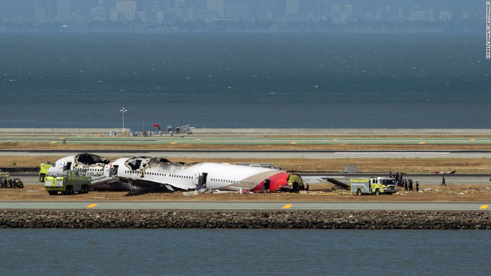 Crews surround the remains of the plane on July 6.