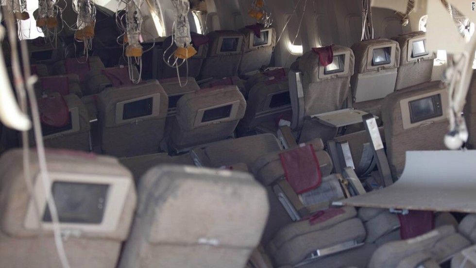 A photo showing the damaged interior of the aircraft was released by the NTSB on July 7. The flight carrying 291 passengers and 16 crew took off from Shanghai and stopped in Seoul before heading to San Francisco.