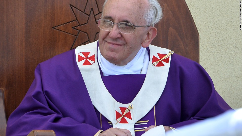 The pope held a mass for 15,000 people under blazing sun at an outdoor sporting center on the island. Standing at an altar made of the wooden remnants of refugee boats and dressed in purple robes normally reserved for lent and mourning, Pope Francis gave an emotional homily focused on &quot;global indifference&quot; to the refugee and irregular migrant problem.