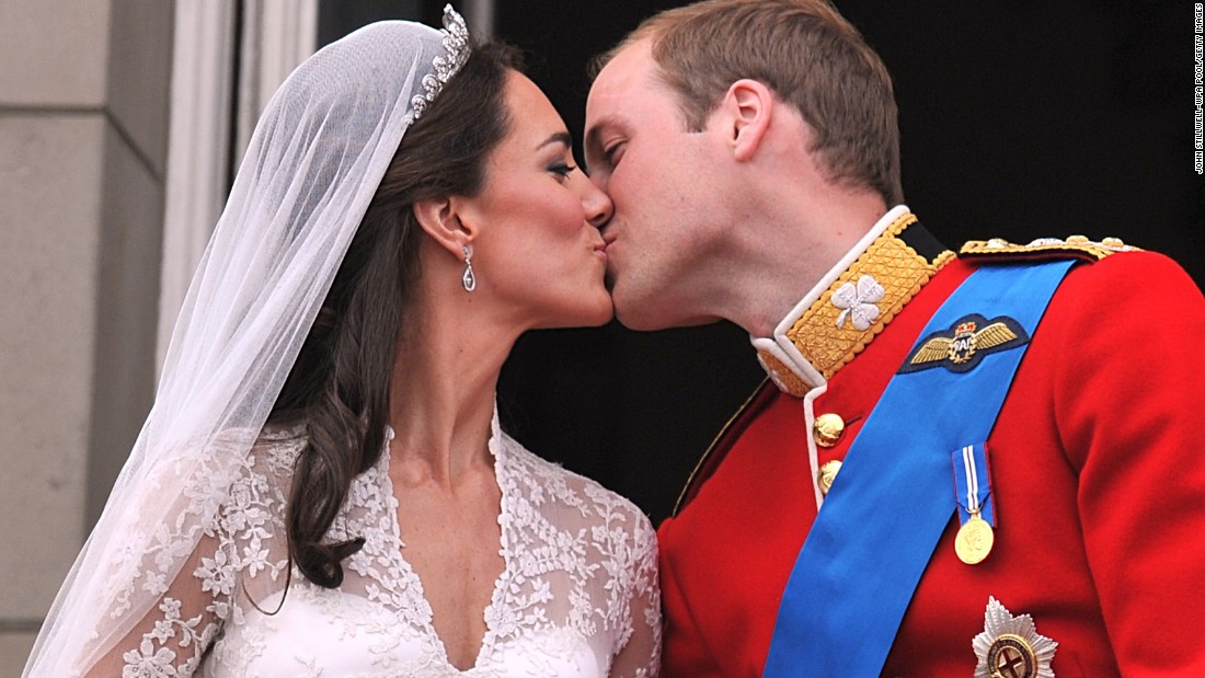 William and Catherine kiss on the balcony of Buckingham Palace after their wedding ceremony in London. 