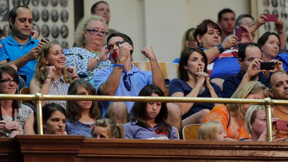 Supporters of the measure react in the gallery of the Texas House after it was provisionally approved during the second special session on July 9, 2013.