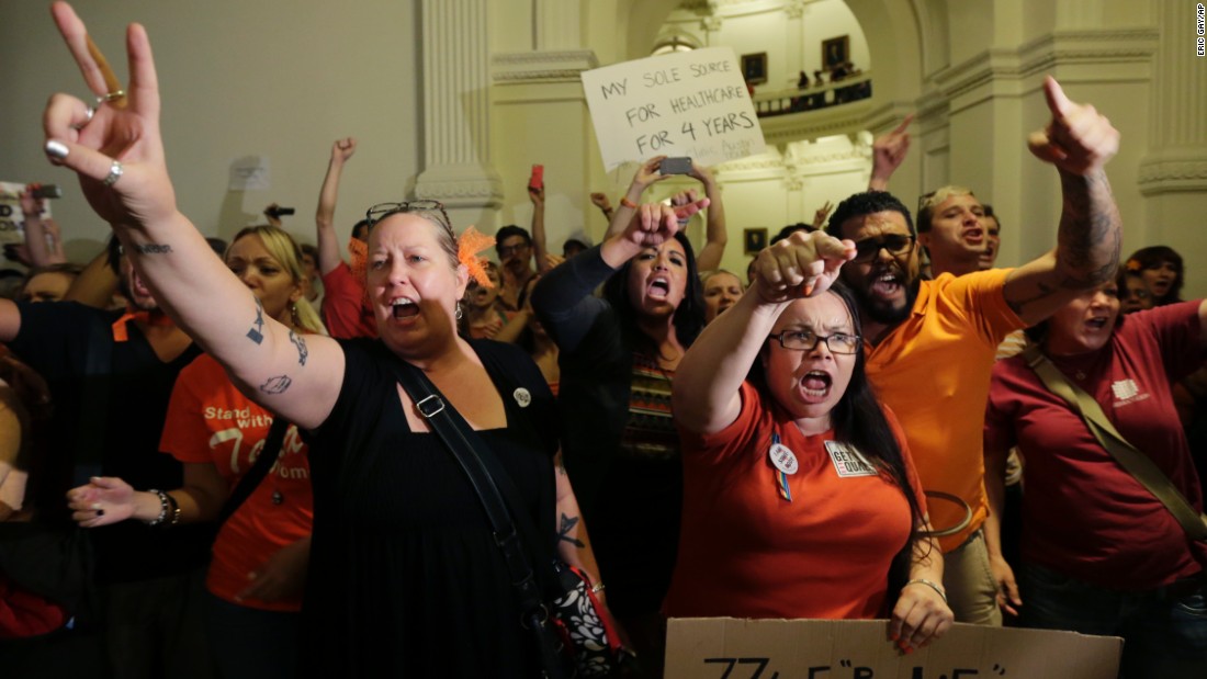 Opponents of the bill yell outside the Texas House after the bill was provisionally approved.