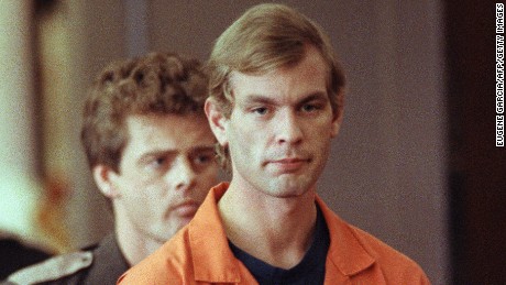 MILWAUKEE, WI - AUGUST 6:  Suspected serial killer Jeffrey L. Dahmer enters the courtroom of judge Jeffrey A. Wagner 06 August 1991. Dahmer has been charged with eight additional counts of first-degree murder, bringing the number of homicides he is charged with to 12. The judge increased Dahmer&#39;s bail to five million dollars. He was sentenced to fifteen consecutive life terms or a total of 957 years in prison. Dahmer was killed by a fellow prisoner, Christopher Scarver, 28 November 1994 at Columbia Correctional Institution, Portage, Wisconsin. (FILM)  (Photo credit should read EUGENE GARCIA/AFP/Getty Images)