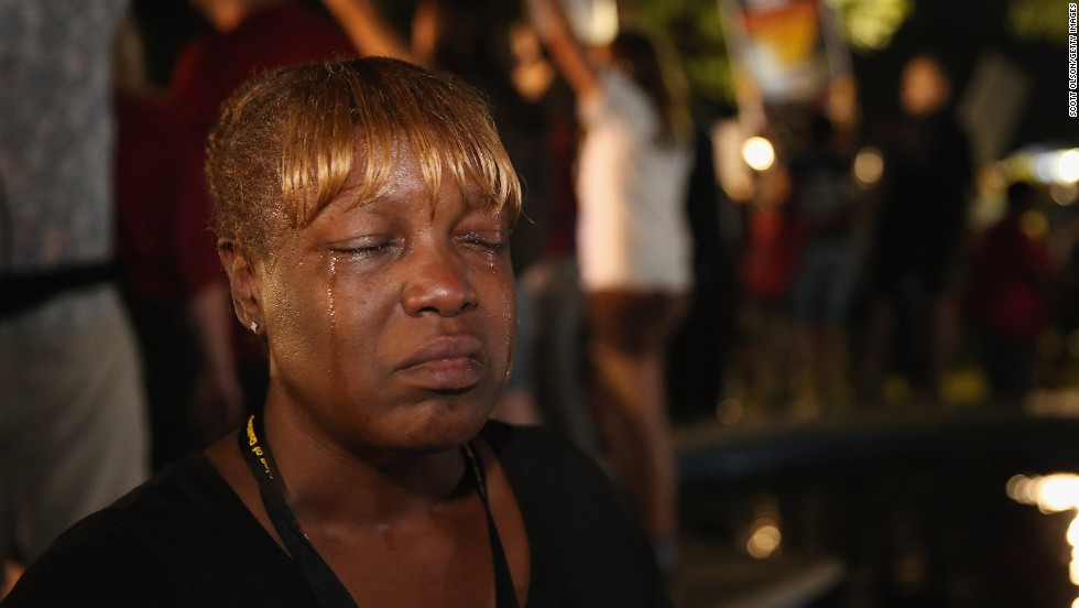 Tanetta Foster cries in front of the courthouse on July 13 after hearing the verdict.