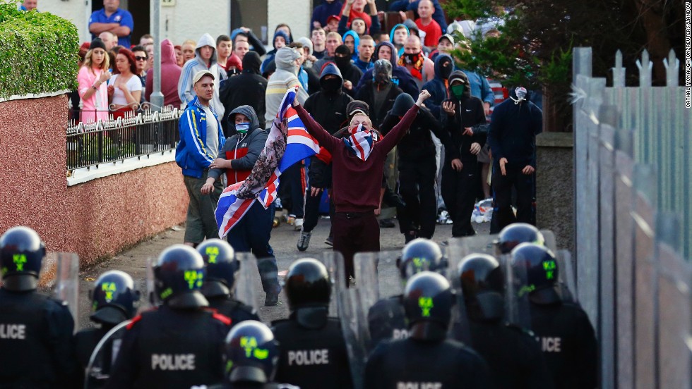 Northern Irish loyalists clash with police in Belfast, Northern Ireland, on Saturday, July 13, a day after protests broke out because a Protestant Orange Order parade was blocked from marching past the predominantly Catholic and nationalist Ardoyne area.