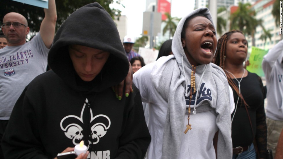 Demonstrators march following a rally at the Torch of Freedom in downtown Miami on July 14.