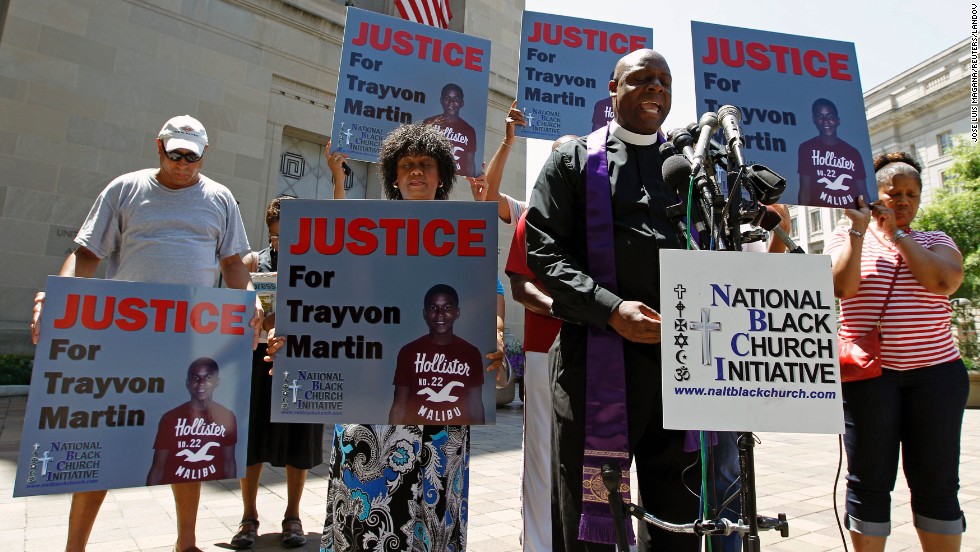Outside the Department of Justice in Washington on July 15, Rev. Anthony Evans, president of the National Black Church Initiative, leads a prayer during a demonstration asking for justice for Trayvon Martin.