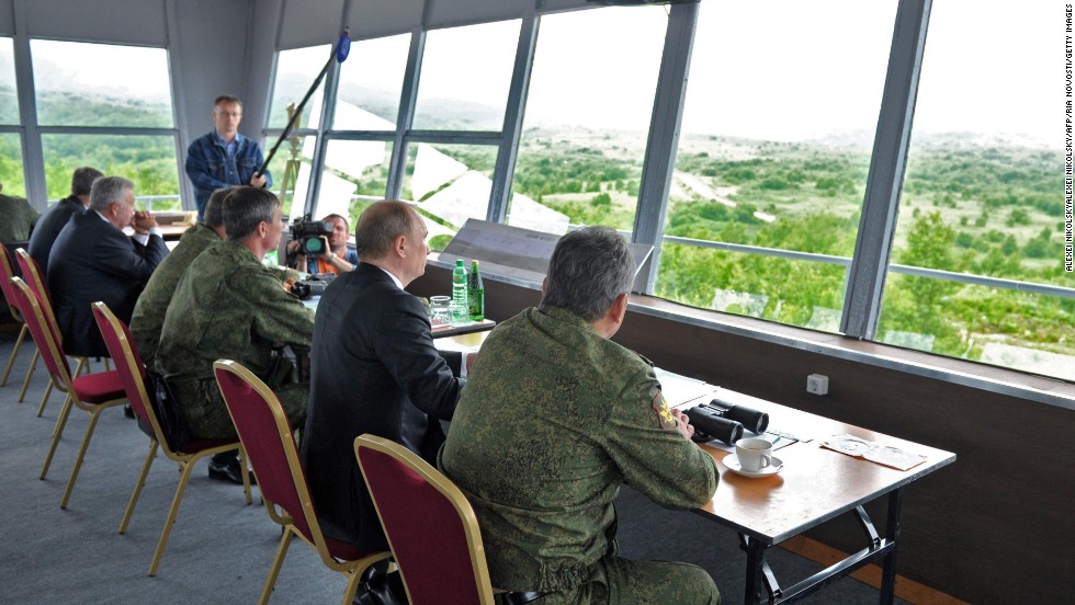 Putin, center, and Russian military personnel observe exercises on July 16.