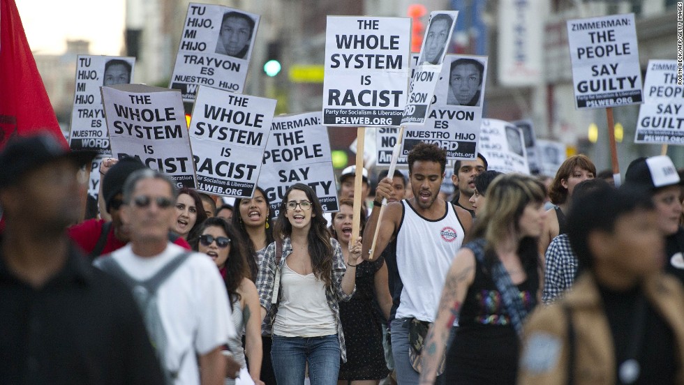 Protesters march through the streets of downtown Los Angeles, on Tuesday, July 16, during a demonstration of the George Zimmerman trial.