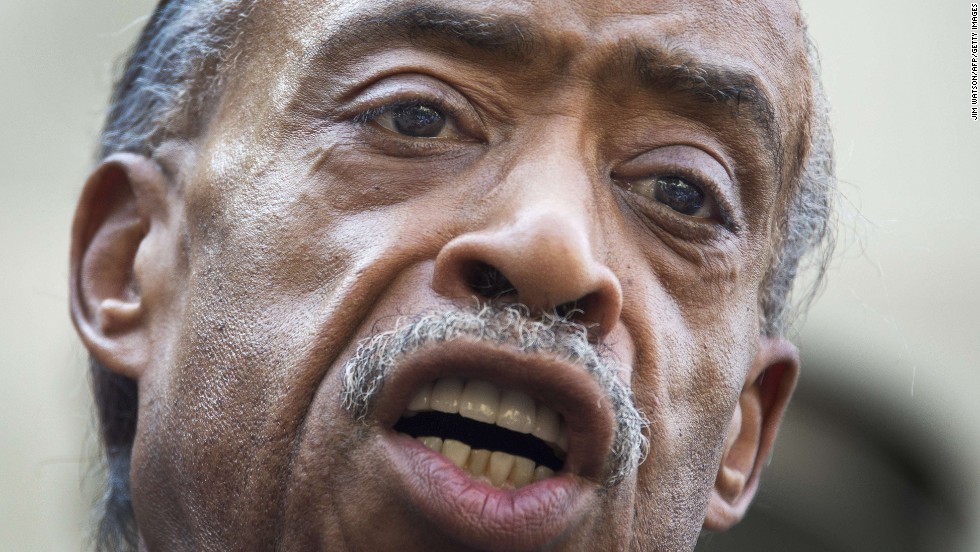 The Rev. Al Sharpton calls for a full federal investigation of the Martin killing, saying mere remarks by President Barack Obama and others weren&#39;t enough, outside the U.S. Justice Department in Washington on July 16.