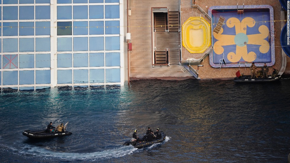 Military rescue workers approach the cruise liner on January 22, 2012.