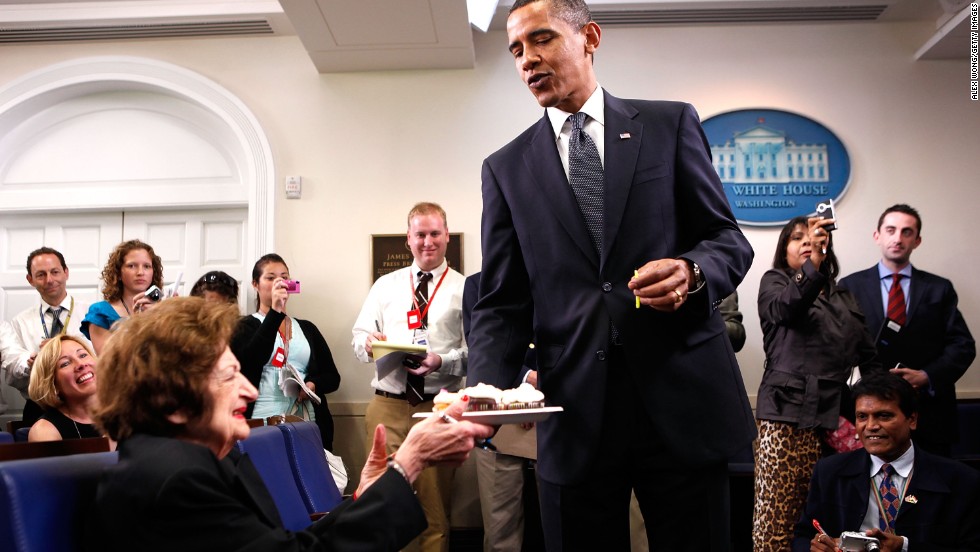 Obama surprises Thomas with cupcakes to celebrate her birthday in the White House briefing room on August 4, 2009. Thomas and Obama share the same birthday.