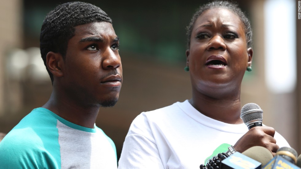 Sybrina Fulton, mother of Trayvon Martin, is joined by her son Jahvaris Fulton as she speaks to the crowd during a rally in New York City, Saturday, July 20. A jury in Florida acquitted Zimmerman of all charges related to the shooting death of Trayvon Martin. &lt;a href=&quot;http://www.cnn.com/2013/06/27/justice/gallery/zimmerman-trial/index.html&quot;&gt;View photos of key moments from the trial.&lt;/a&gt;
