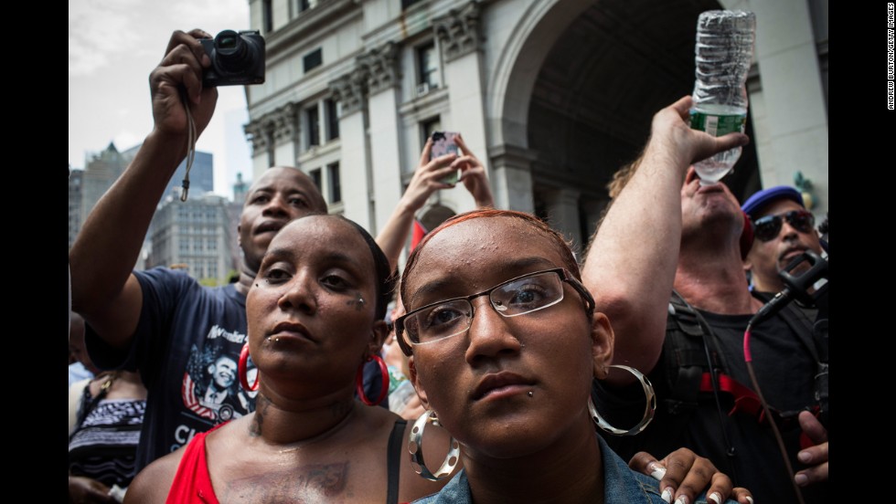 Protesters attend a rally in support of Trayvon Martin, in New York  on July 20. The Rev. Al Sharpton&#39;s National Action Network organized the &quot;&#39;Justice for Trayvon&#39; 100 city vigil&quot; which called supporters to gather in front of federal buildings around the country on July 20, as a continued protest against the George Zimmerman verdict.