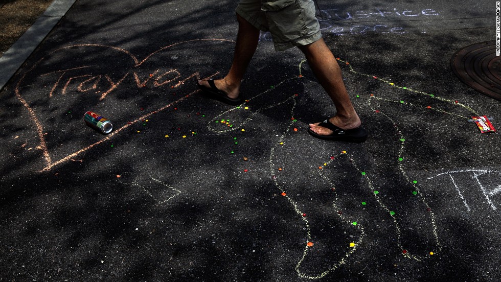 A chalk outline, a bag of Skittles, and a can of iced tea are seen during the vigil outside the E. Barrett Prettyman Federal Courthouse in Washington, D.C., on July 20.