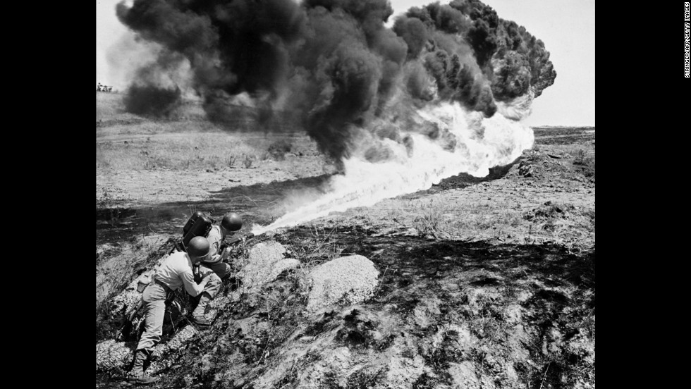 Marines use a flamethrower in April 1951.