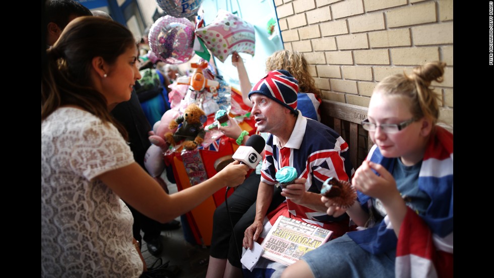 Royal supporters are interviewed by a television crew outside St. Mary&#39;s Hospital on July 22.
