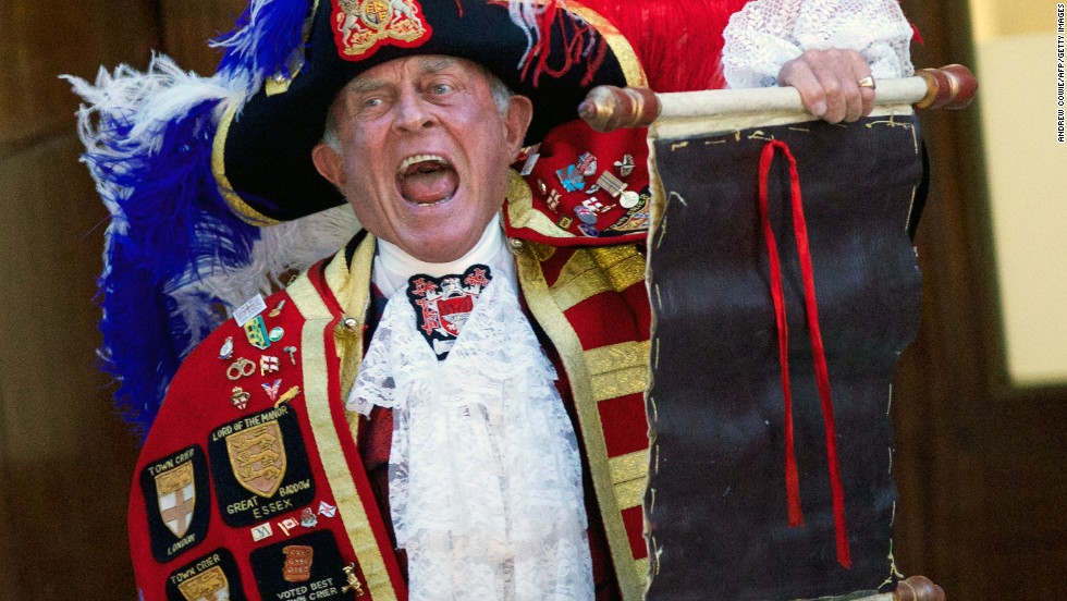 A town crier reads the announcement of the birth outside the Lindo Wing of St. Mary&#39;s Hospital in London on July 22.