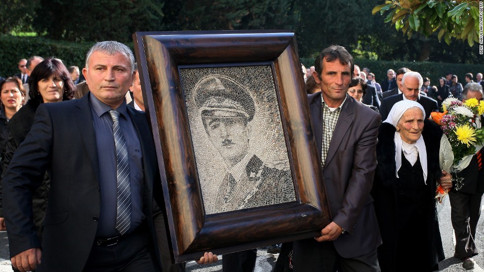 After being booted out of Albania in 1939, the dictatorial King Zog&#39;s unlikely residence was Parmoor House, in Buckinghamshire -- it&#39;s currently a religious retreat. Here, supporters of the self-titled Zog carry his portrait at a reburial ceremony in Tirana.
