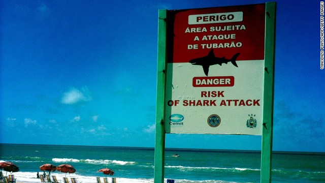 A shark warning sign is pictured on the beach in Recife, Brazil, on June 19.