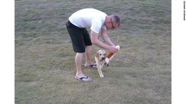 1st Lt. Brandon Harker plays with Oakley before being deployed.